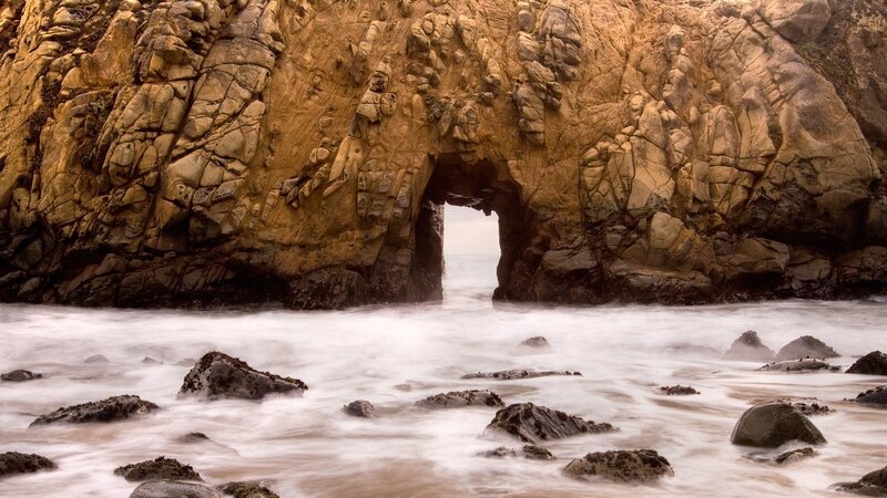 Rock Arch at Coastline — Brown