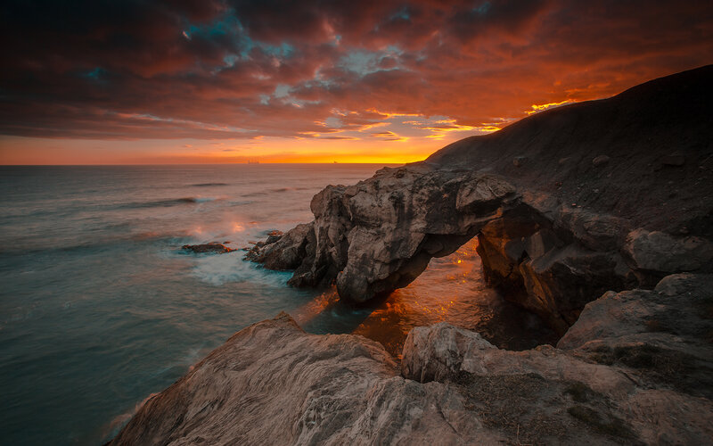 Rock Arch at Sunset — Orange, Dramatic, Photograph, Ocean, Clouds