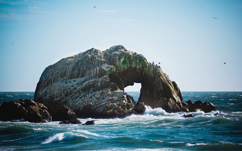 Rock Arch Formation — Blue, Dramatic, Afternoon, Photograph, Ocean, Birds