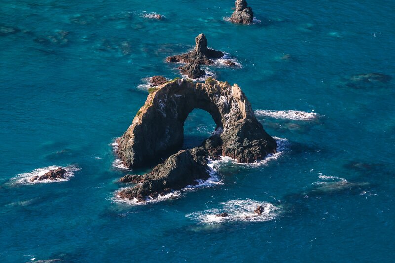Rock Arch Formation — Blue, Serene, Afternoon, Photograph, Ocean, Rocks