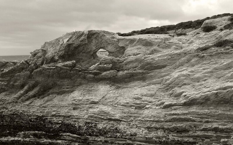 Rock Arch Formation — Gray, Dramatic, Photograph