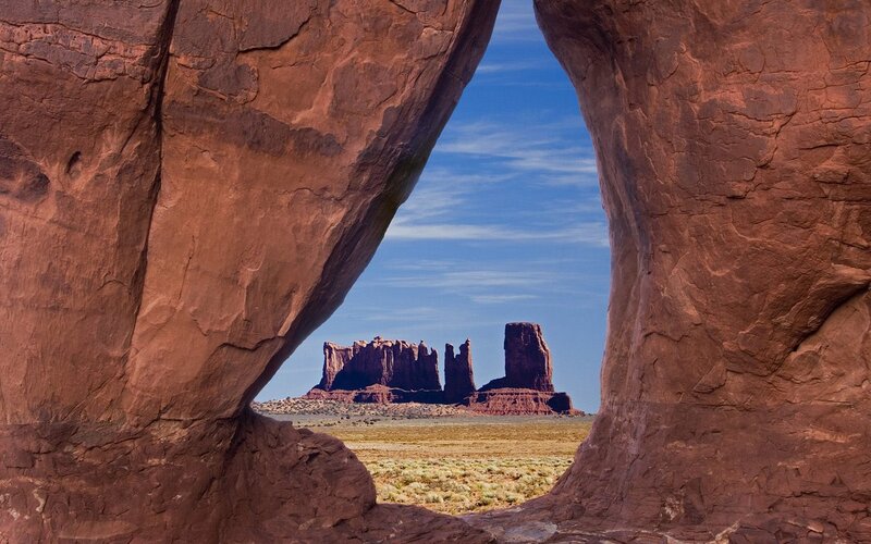 rock arch framing buttes