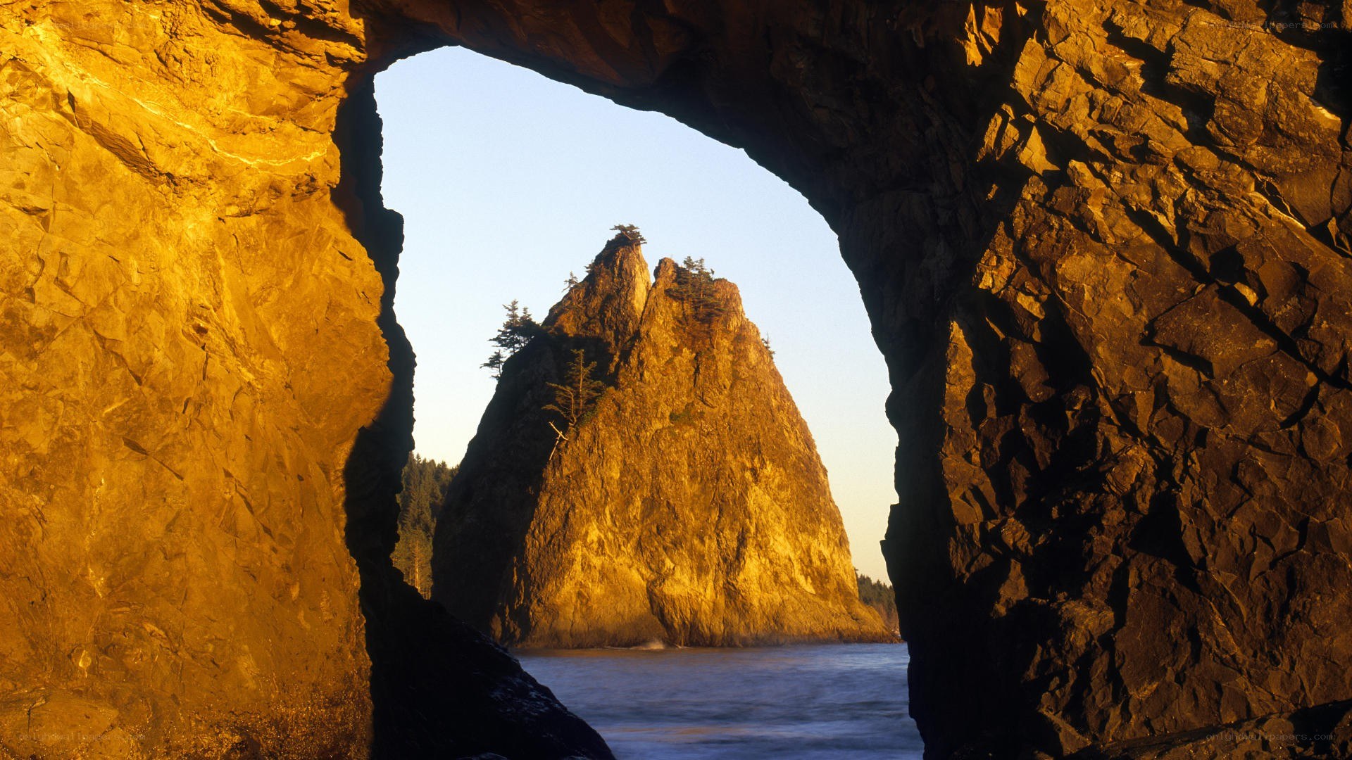 Rock arch framing sea stack