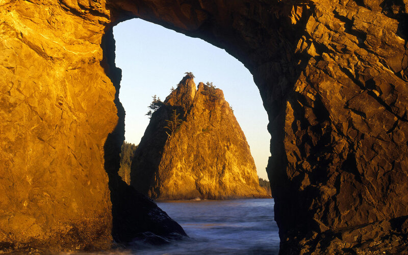 Rock arch framing sea stack