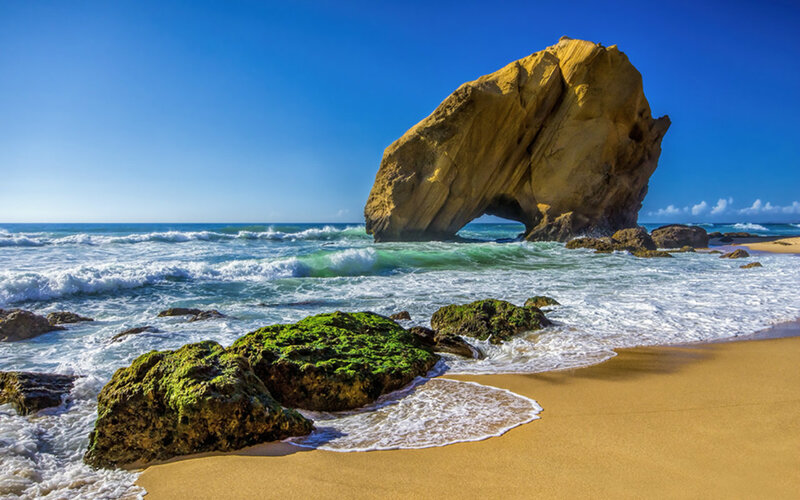 Rock Arch on Beach — Blue, Serene, Afternoon