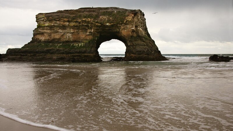 Rock Arch on Beach — Gray, Dramatic