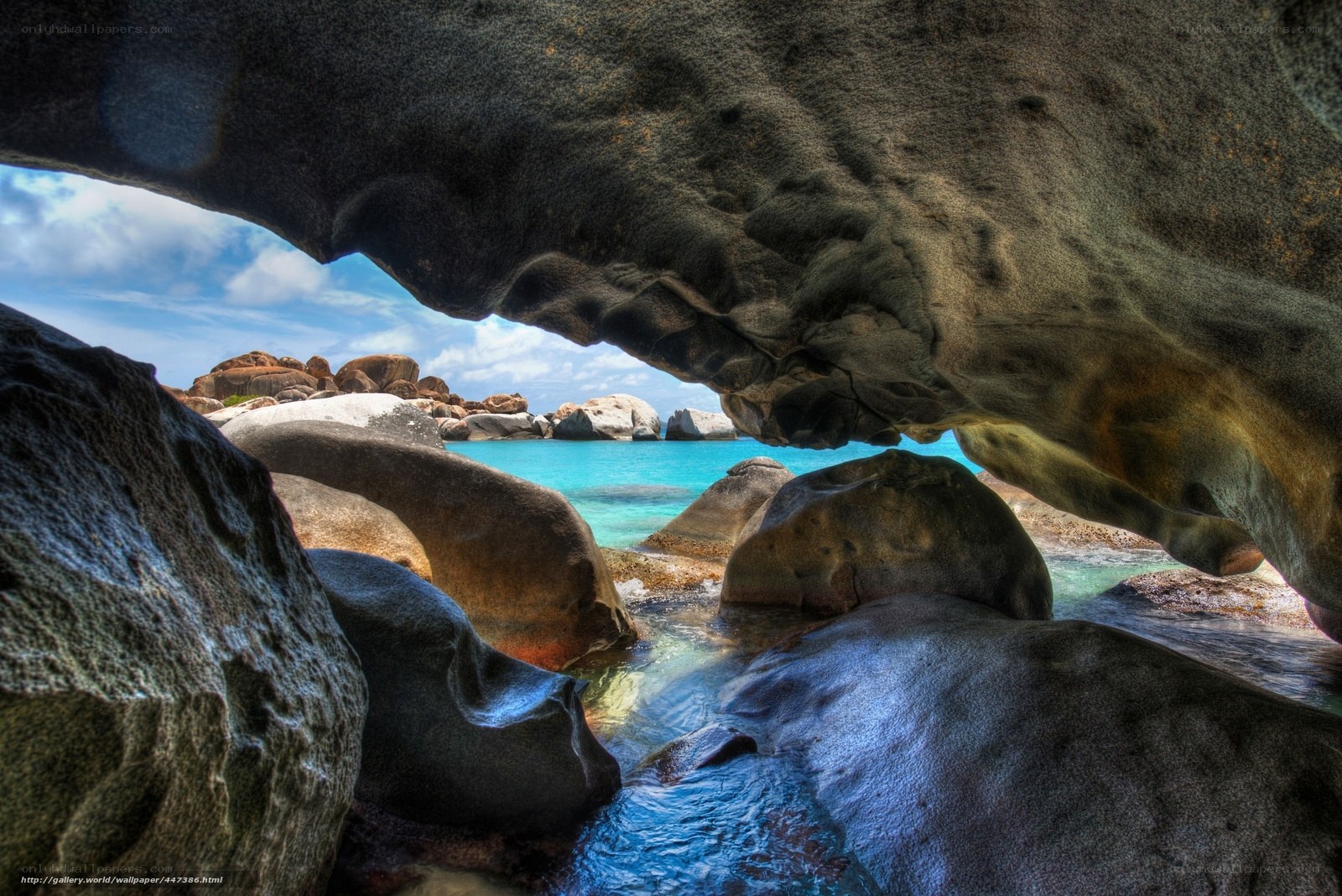 Rock arch overlooking turquoise sea