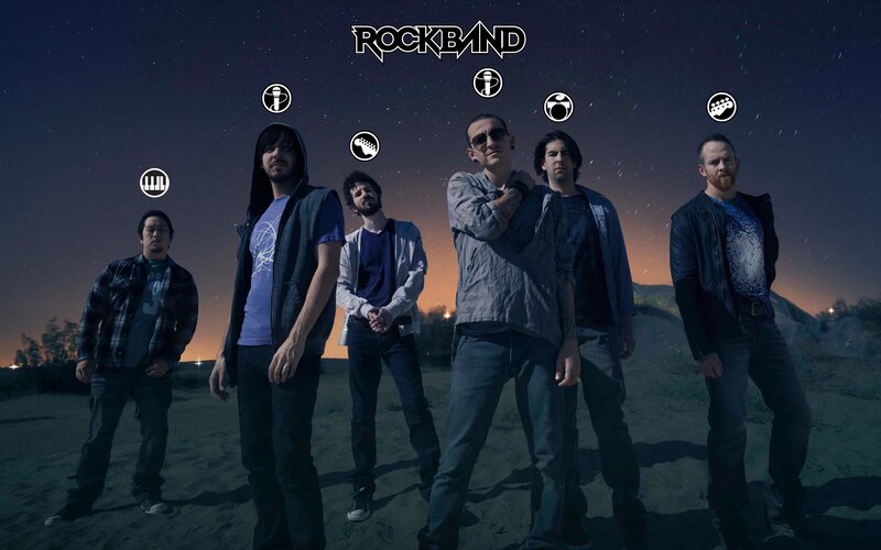 Rock band in desert at night