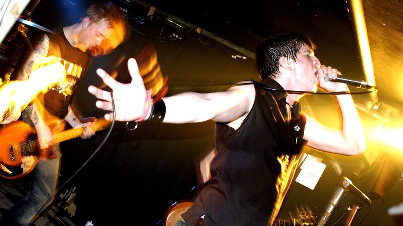 Rock Band Performing on Stage — Black