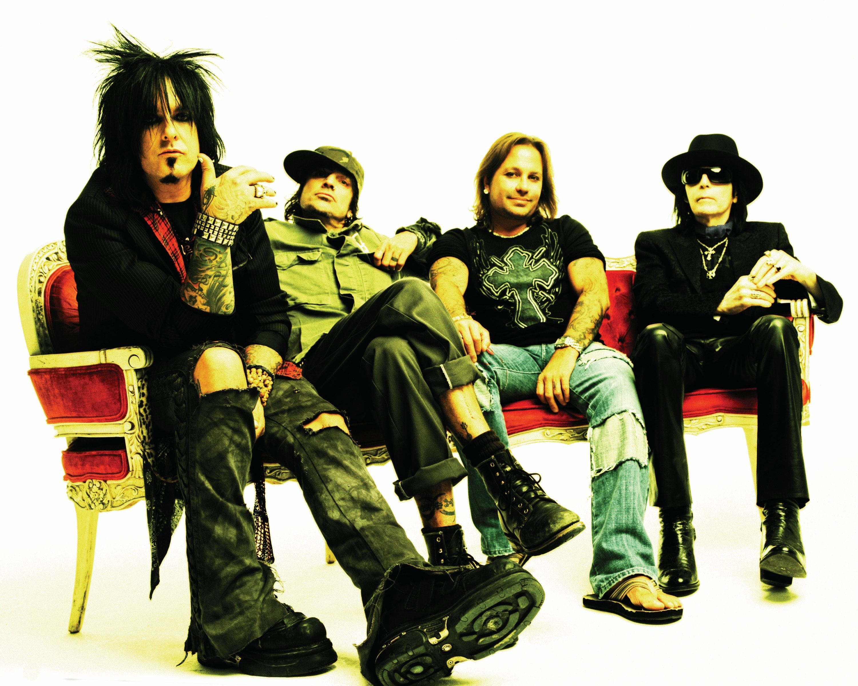 rock band posing on a couch