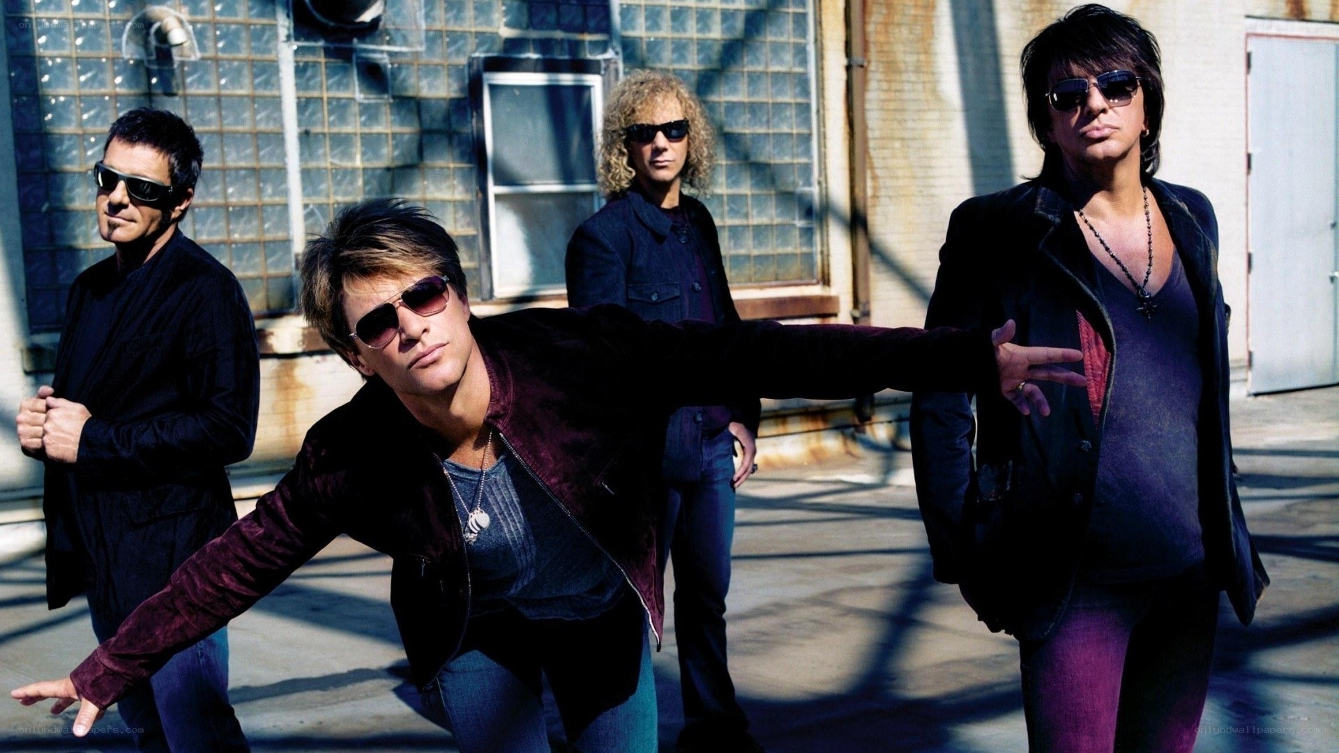 rock band posing outdoors