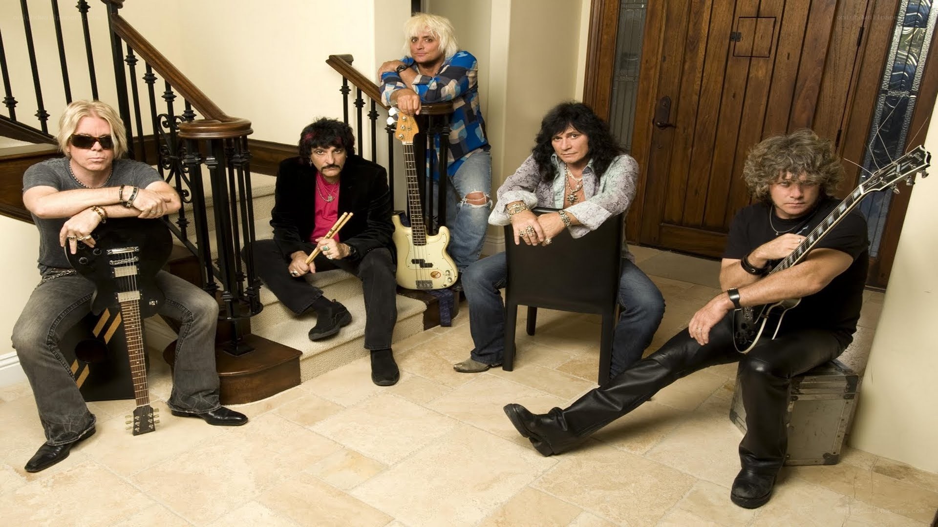 rock band posing with instruments