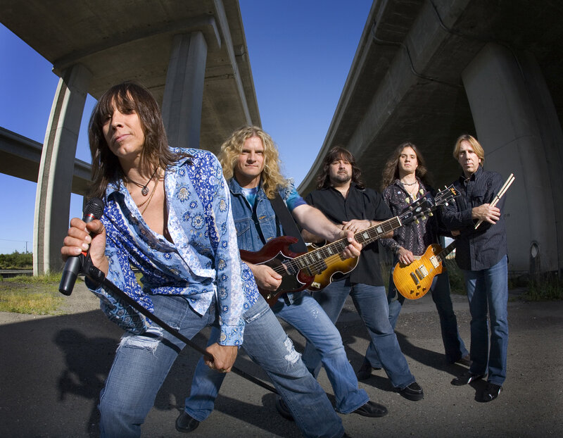 Rock band under a highway overpass