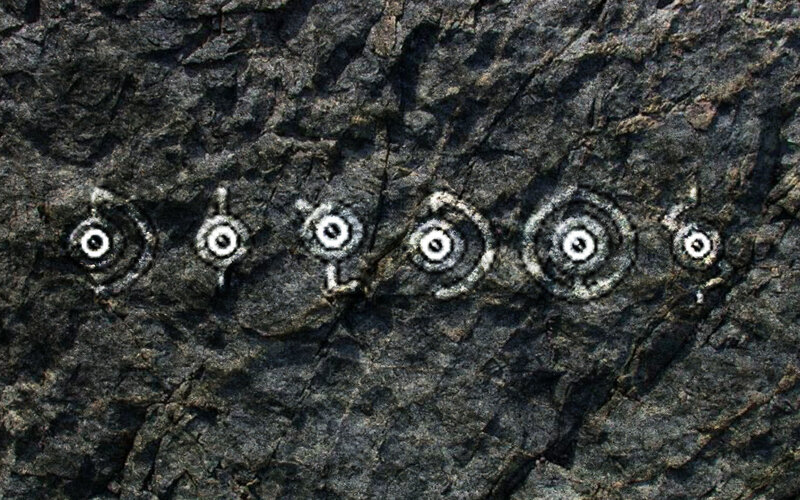 rock carvings in a row
