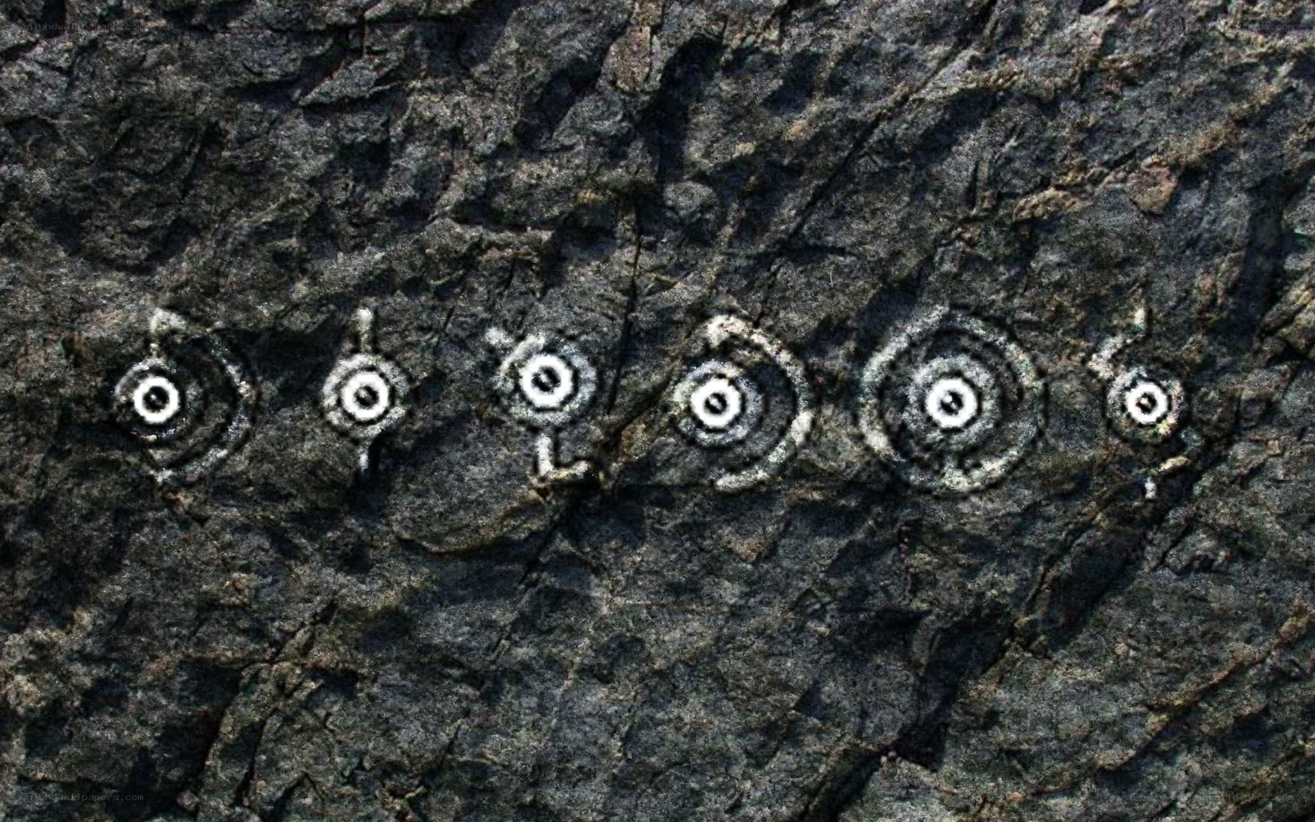 rock carvings in a row