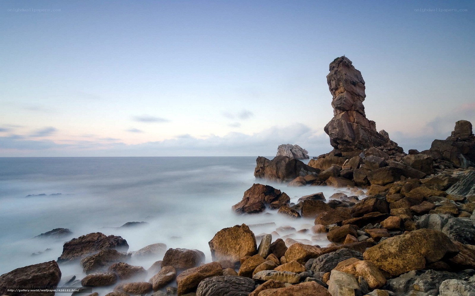 Rock formation at coastal sunset