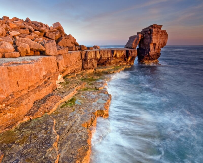 Rock Formation at Coastline — Orange, Serene, Sunset, Photograph, Ocean, Sky