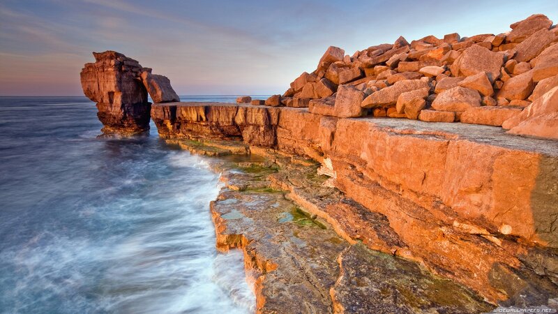 Rock Formation at Coastline — Orange, Serene, Sunset, Photograph, Ocean