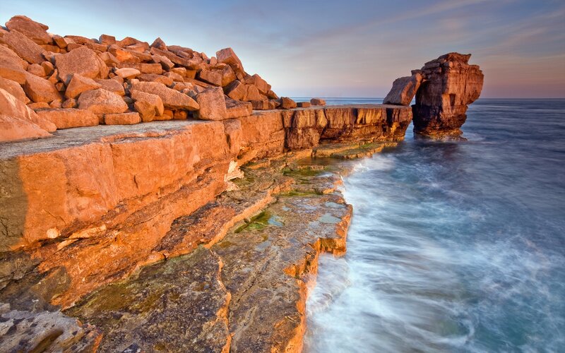 Rock Formation at Coastline — Orange, Serene