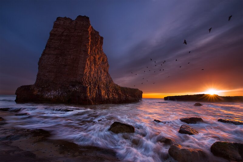 Rock Formation at Sunset — Orange, Dramatic, Photograph, Birds