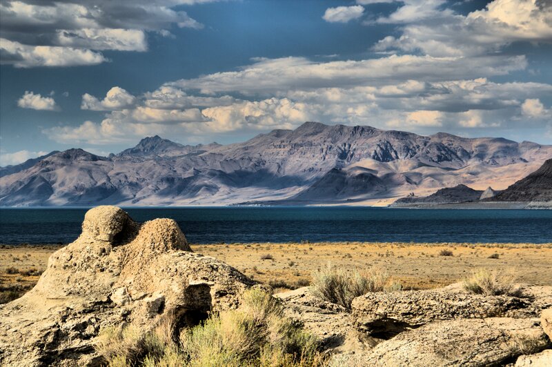 Rock Formation by Lake — Blue
