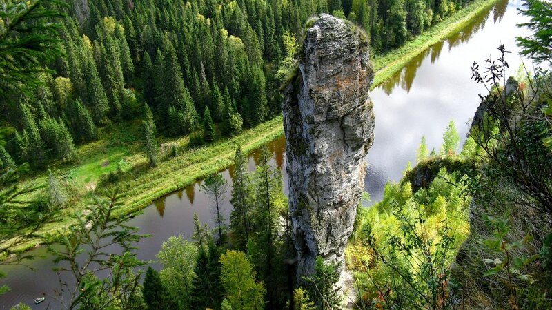 Rock Formation by River — Green, Serene