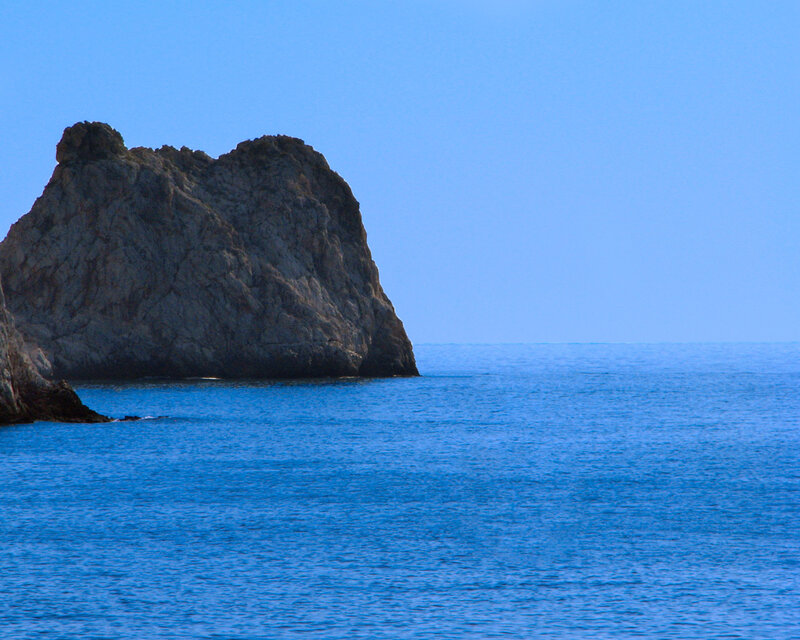 Rock formation in blue sea