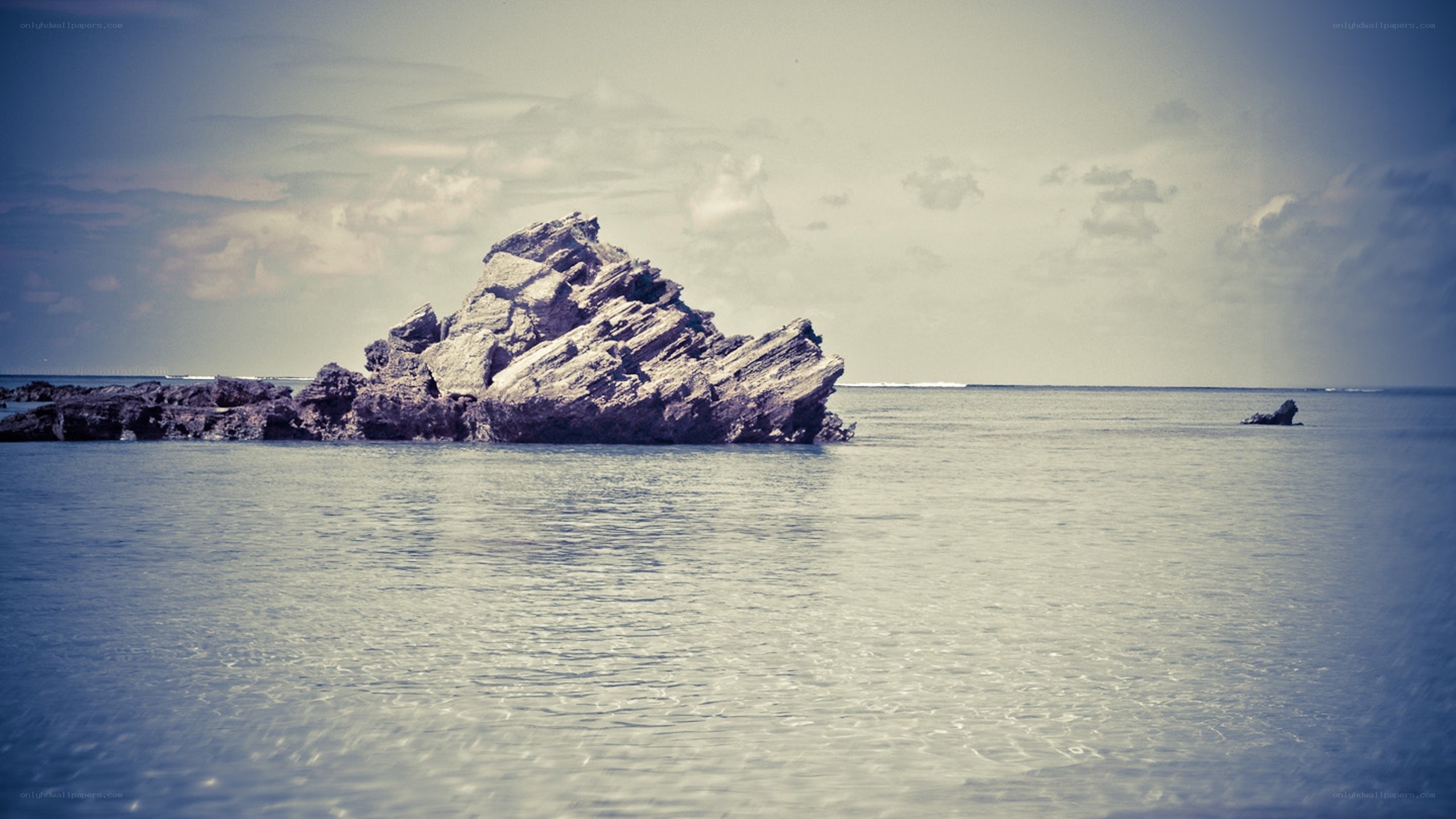 Rock formation in calm sea