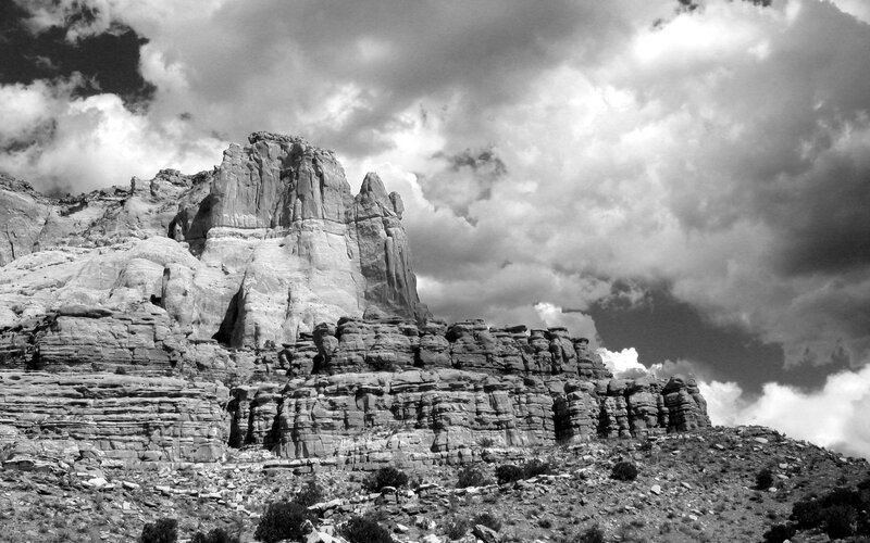 Rock Formation in Desert — Black, Dramatic, Photograph, Clouds, Rocks, White