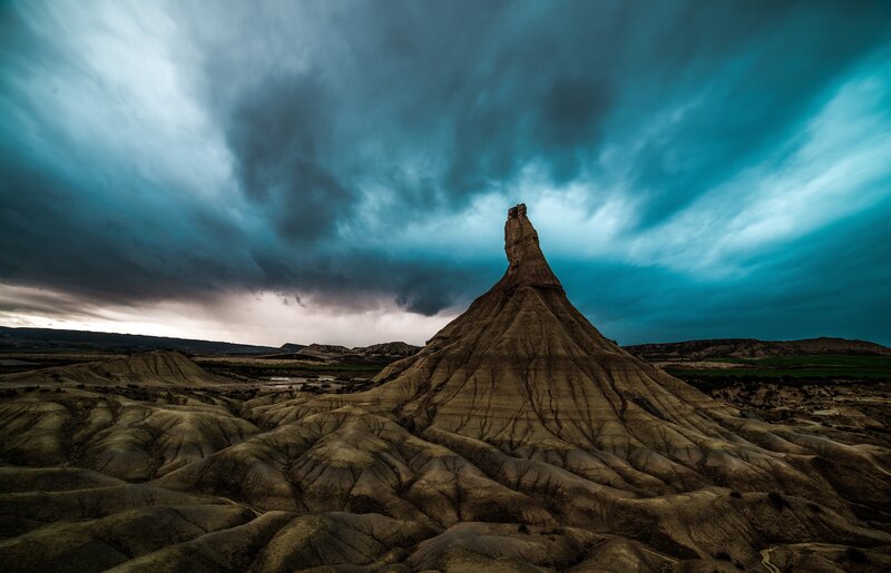 Rock Formation in Desert — Blue, Dramatic, Sunset, Photograph, Sky, Clouds