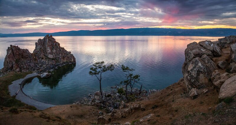 Rock Formation in Lake — Blue, Serene, Sunset, Photograph, Mountains, Trees