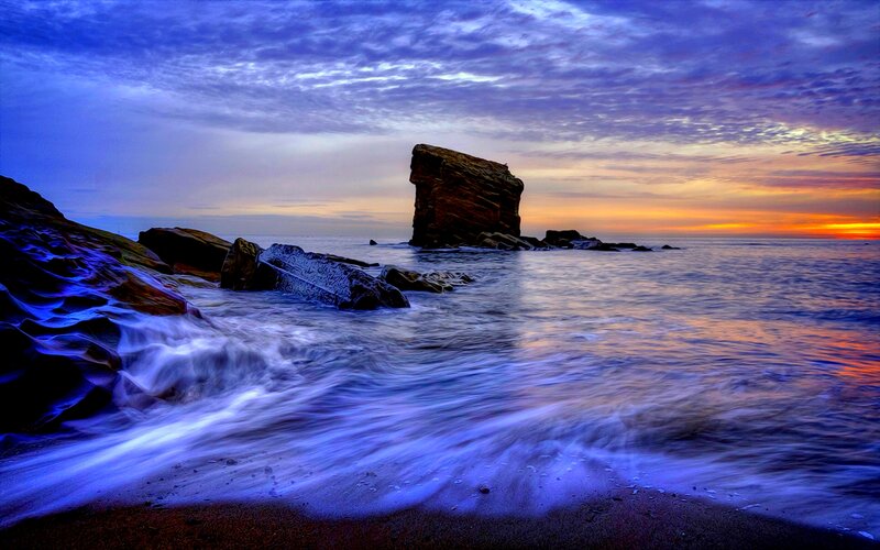 Rock Formation in Ocean — Blue, Dramatic, Sunset, Photograph, Sky, Rocks