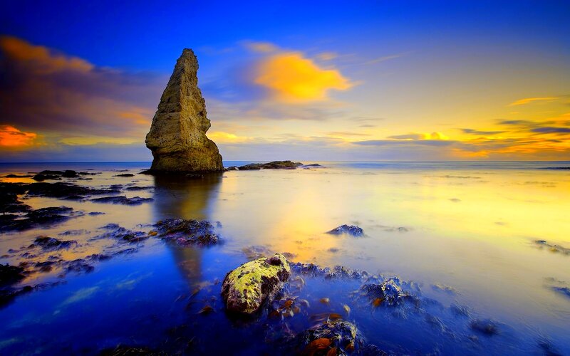 Rock Formation in Ocean — Blue, Dramatic, Sunset, Photograph, Sky