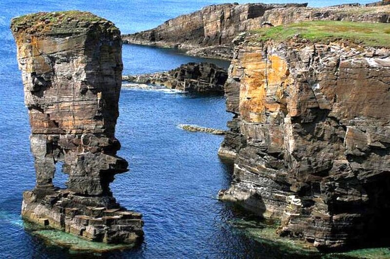 Rock Formation in Ocean — Blue, Dramatic