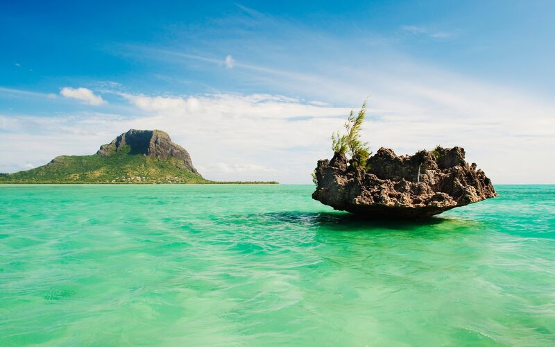 Rock Formation in Ocean — Blue, Serene, Afternoon, Photograph, Island