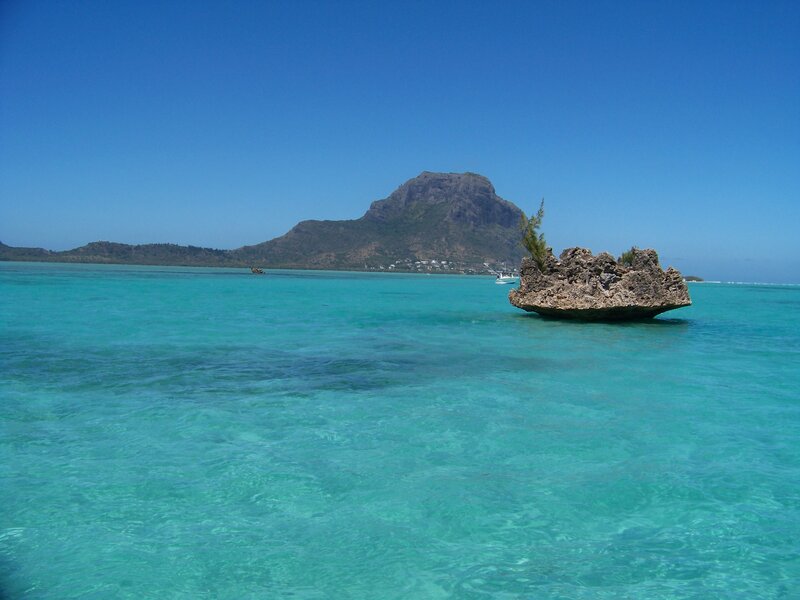 Rock Formation in Ocean — Blue, Serene, Afternoon, Photograph, Mountain