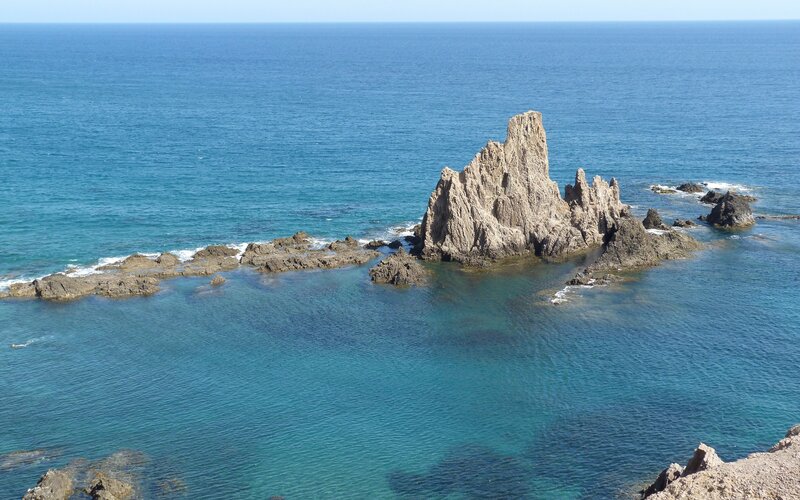 Rock Formation in Ocean — Blue, Serene, Afternoon, Photograph, Rocks