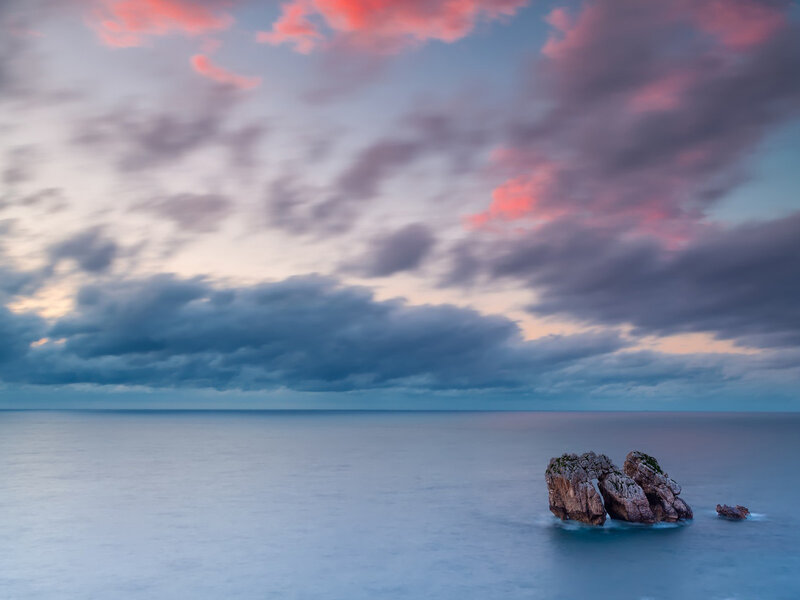 Rock Formation in Ocean — Blue, Serene, Sunset, Photograph, Clouds
