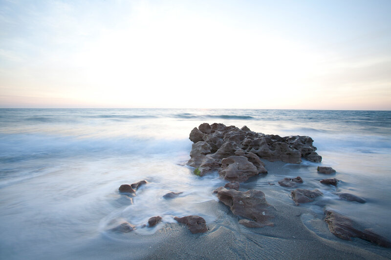 Rock Formation in Ocean — Blue, Serene, Sunset, Photograph