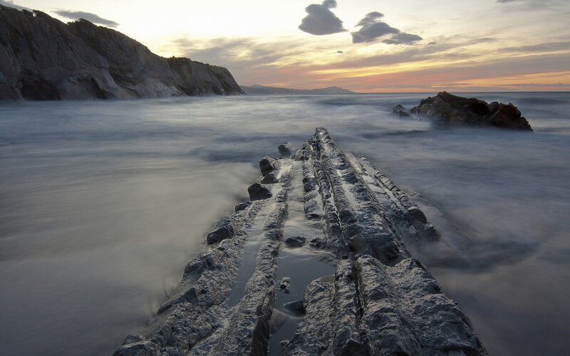 Rock Formation in Ocean — Gray, Serene, Sunset, Photograph