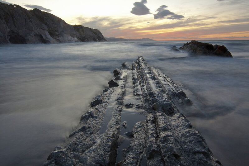 Rock Formation in Ocean — Gray, Serene, Sunset