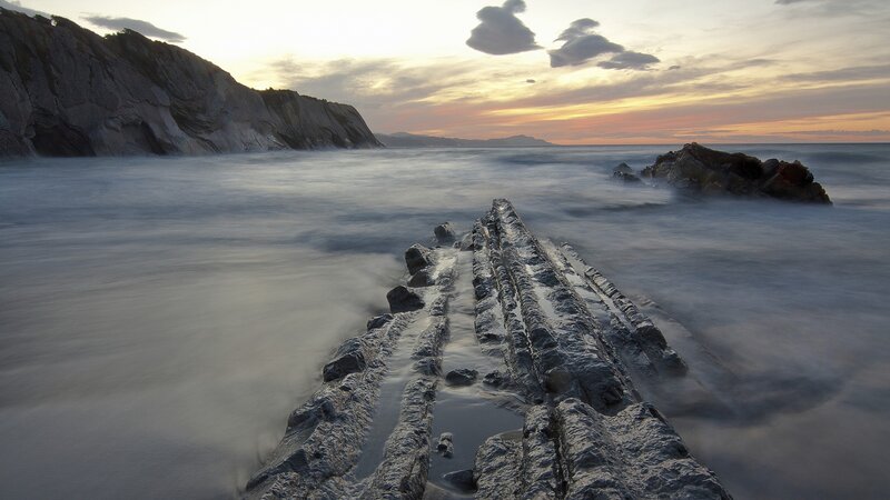 Rock Formation in Ocean — Gray, Serene