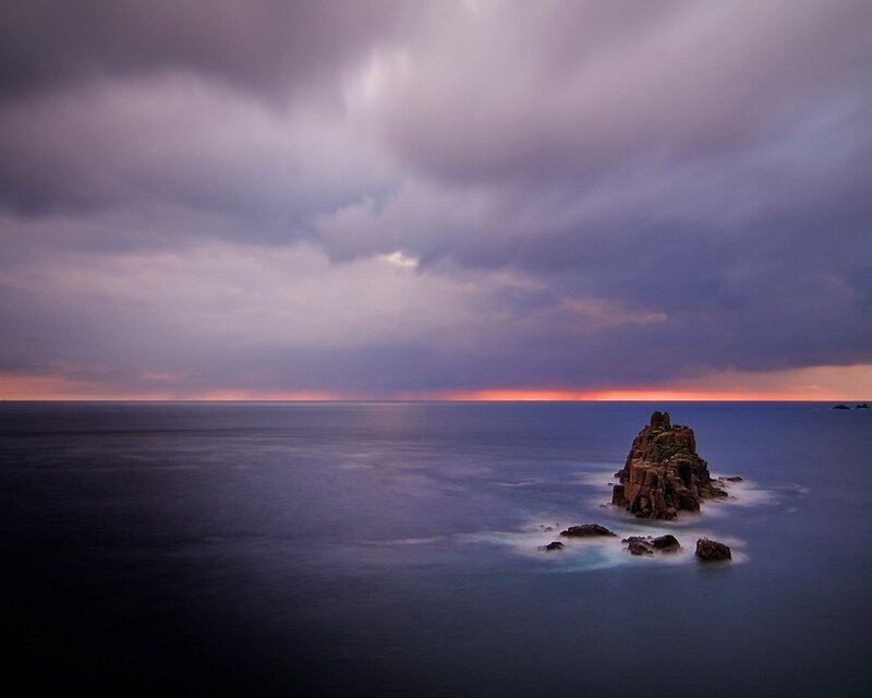 Rock Formation in Ocean — Purple, Dramatic