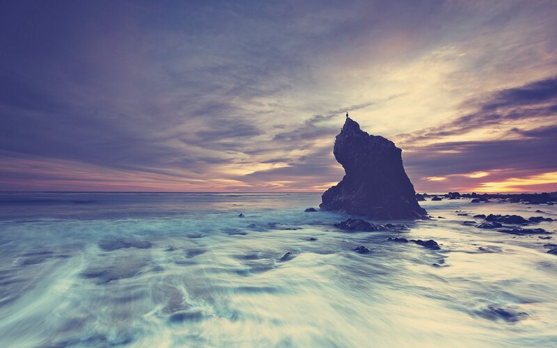 Rock Formation in Ocean — Purple, Serene