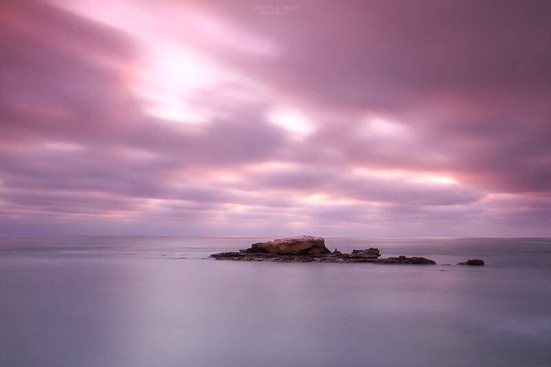 Rock Formation in Ocean — Purple