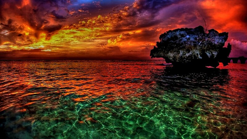 Rock Formation in Ocean — Red, Dramatic