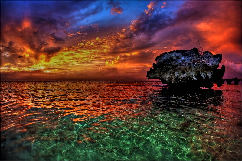 Rock Formation in Ocean — Red