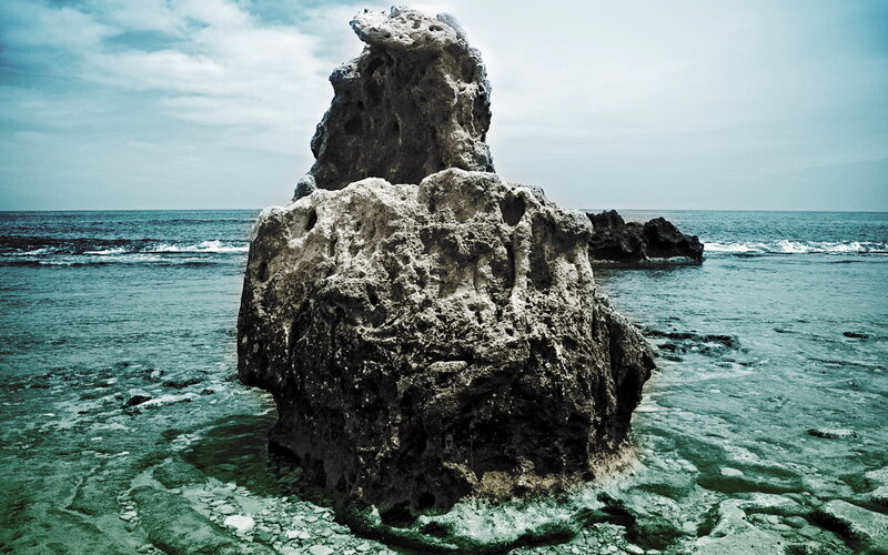 Rock Formation in Ocean — Sky