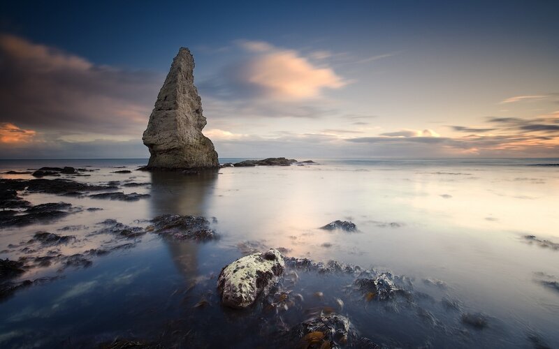 Rock Formation in Ocean — Sunset