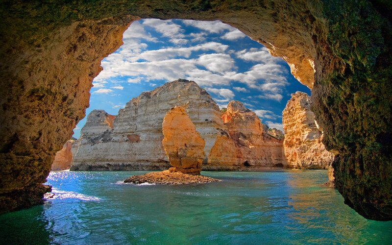 Rock Formation in Sea — Blue, Serene, Afternoon, Photograph, Cave
